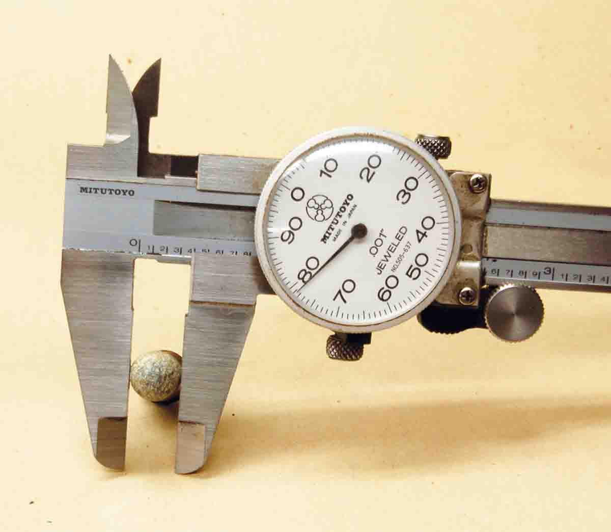 A caliper indicates an outside lubed bullet diameter of .378 inch (a .37-caliber bullet) of the .38 Colt Navy.